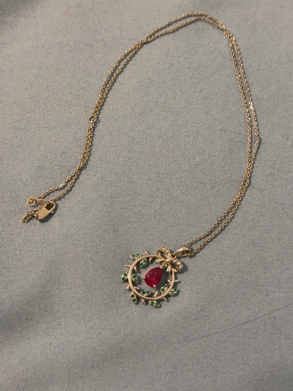 Silver-Tone Necklace with Ruby Teardrop and Emerald Accent Stones